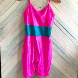 Retro 80’s bicycle suit.  Neon pink one piece